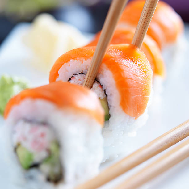 istock eating sushi with chopsticks 508516447