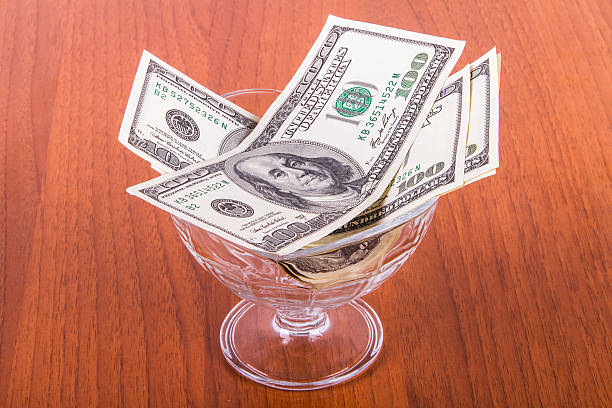 istock Dollar Banknotes in Glass Bowl 508516717