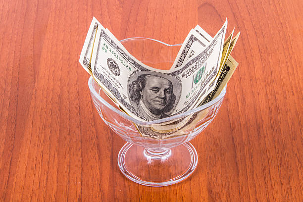 istock Dollar Banknotes in Glass Bowl 508516719