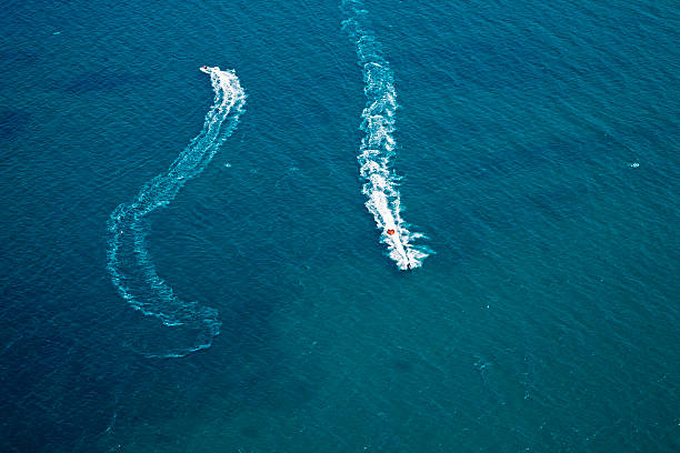istock two jet boats making curves on the sea 508517793