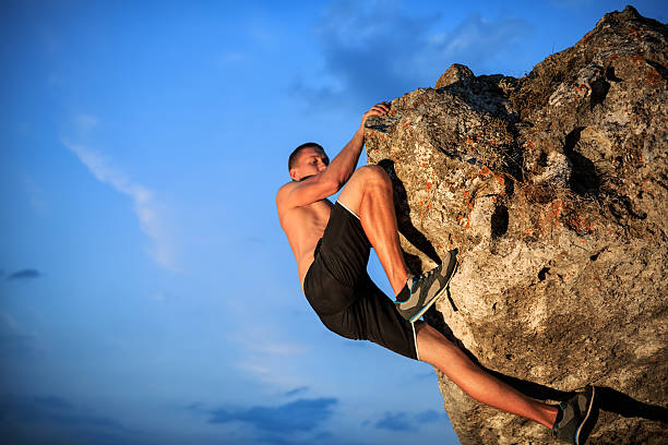 istock Free climber holding on the cliff 508518494