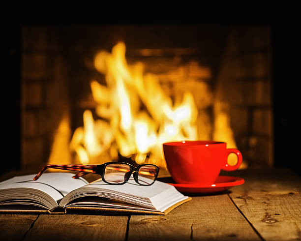 istock Red cup of coffee or tea, glasses and old book 508519010