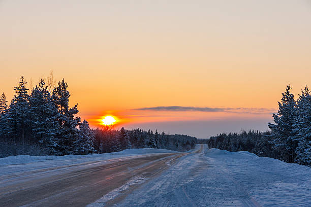 istock road in winter at sunset 508519678