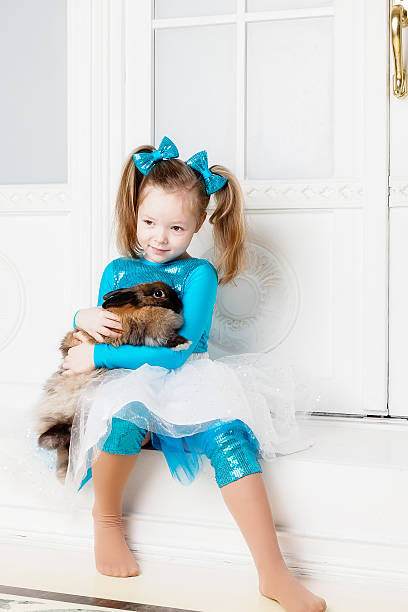 istock Girl hugs rabbit 508520692