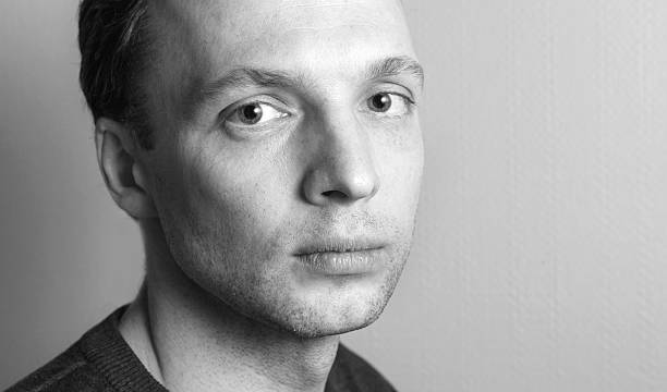 istock Young serious Caucasian man, close-up studio portrait 508523550
