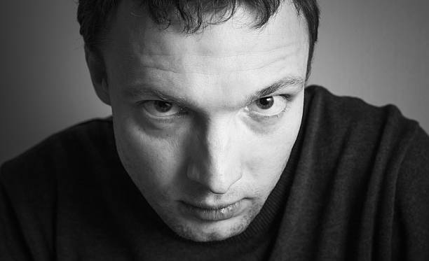 istock Young serious Caucasian man, close-up portrait 508523624