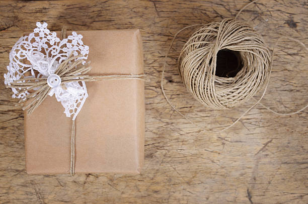 istock Wrapping eco gift packages with brown paper and string 508524822