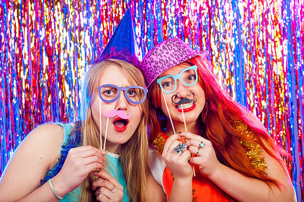 Young nice girls have fun Young nice girls have fun on a dance party photo booth stock pictures, royalty-free photos & images