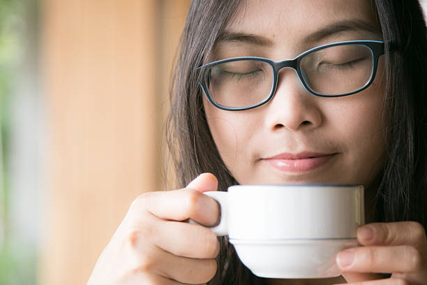 istock Woman smelling coffee 508540438