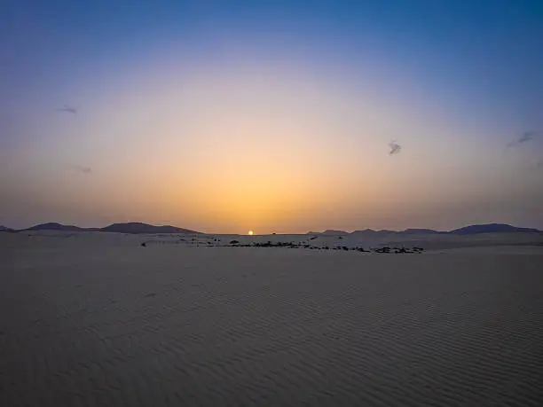 Setting sun with sand patterns in the Natural park,Corralejo,Canary-islands,Spain