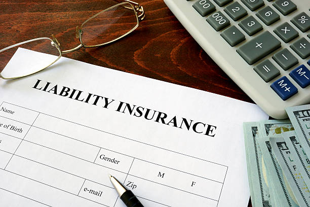 istock Liability insurance  form and dollars on the table. 508544346