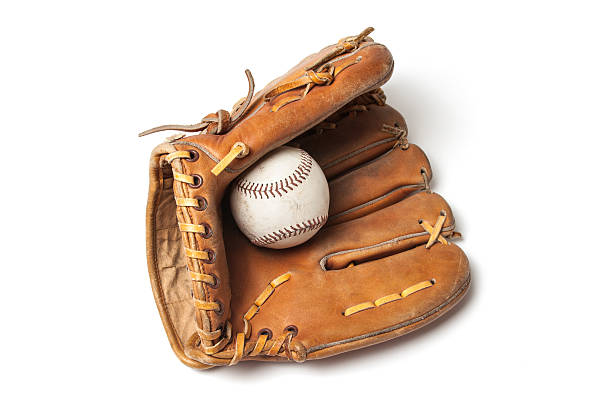 Old baseball with a baseball glove stock photo