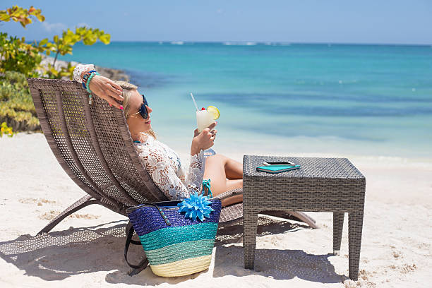 istock Woman relaxing on the beach 508546348