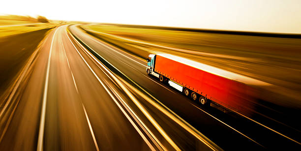 Truck on asphalt road motion blur