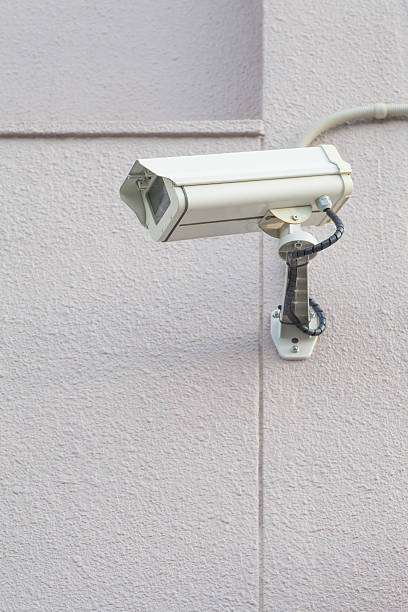 istock Video camera security system on the wall of the building 508547308