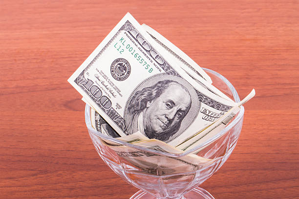 istock Dollar Banknotes in Glass Bowl 508547471