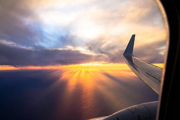 istock Wing aircraft at sunset. Looking Out Through Airplane Window 508551238