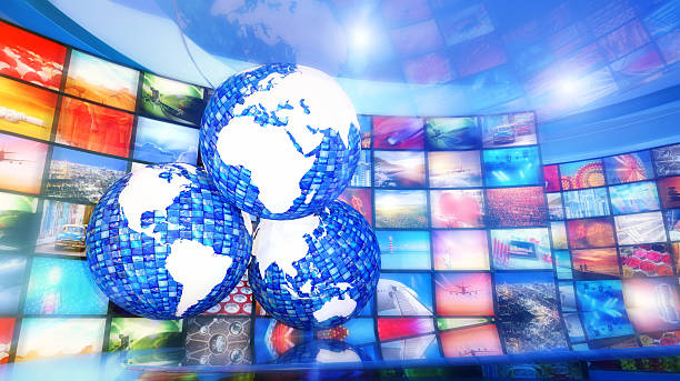 istock Global enterntainment: three world maps surrounded by television videos 508552412