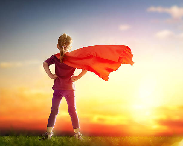 istock girl plays superhero 508555238