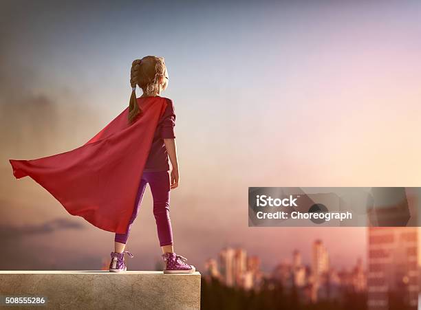 Girl Plays Superhero Stock Photo - Download Image Now - Child, Superhero, Heroes
