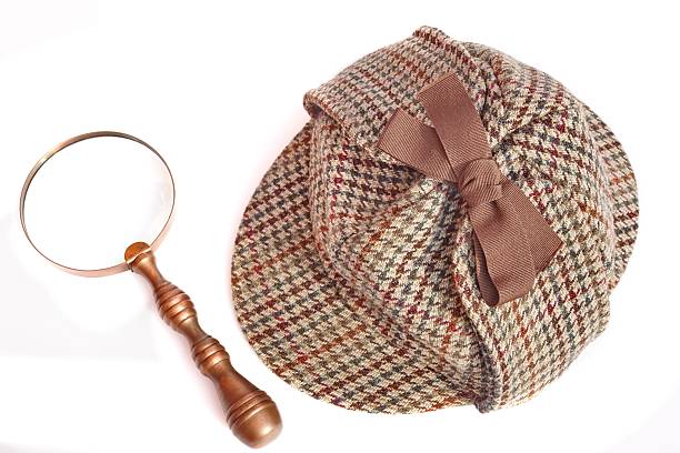istock Deerstalker Hat And Magnifying Glass On Wooden Table 508576793