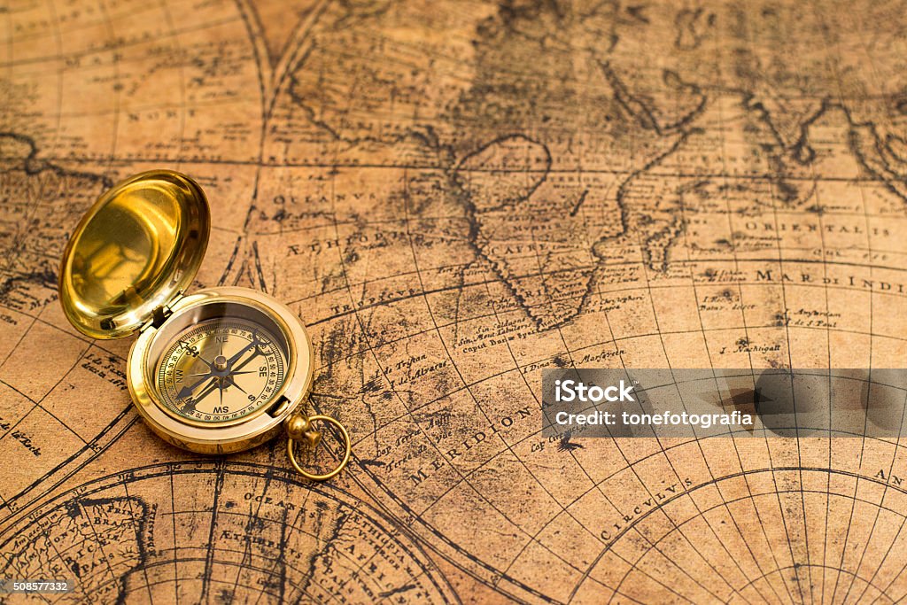 old compass  on vintage map old compass on vintage mapold compass  on vintage mapold compass  on vintage map Map Stock Photo