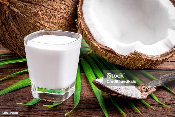 Coconut And Coconut Milk In Glass Stock Photo - Download Image Now - Backgrounds, Breakfast, Brown