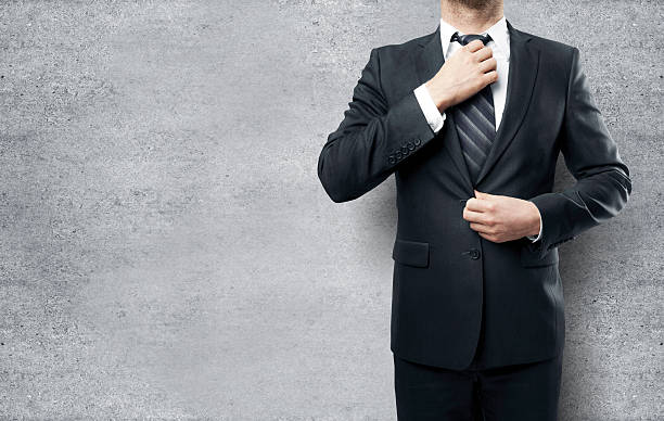 istock Businessman straightens his tie 508580072