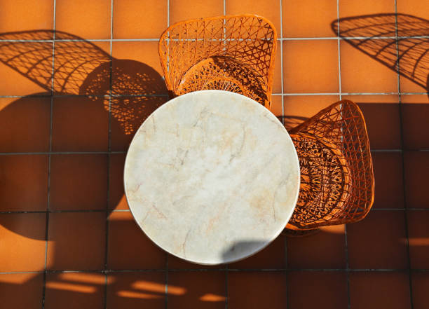 Round table and wicker chairs Round table and wicker chairs on tiled terrace round wooden chair stock pictures, royalty-free photos & images