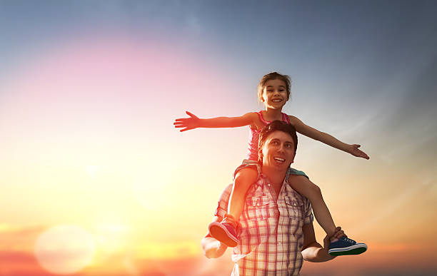 istock happy family at sunset 508582498