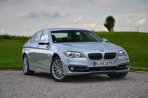 Munich, Germany - July, 5th, 2013. BMW 5-series on the parking before the test drives at the international press launch. The 5-series model is one of the most popular car in premium segment.