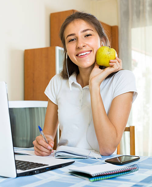 istock young girl using laptop at home 508586828