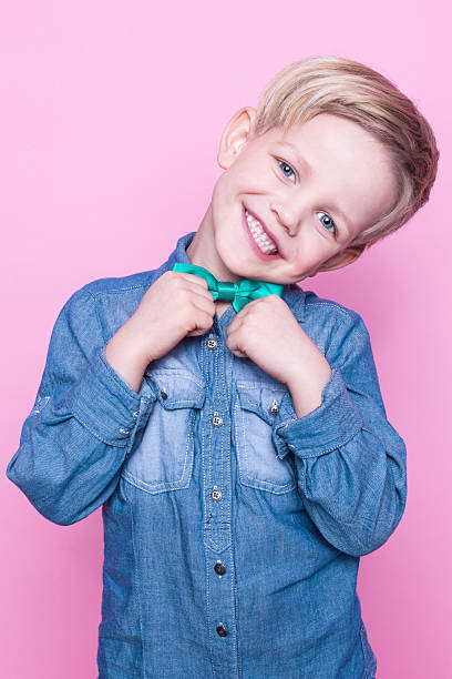 istock Young beautiful boy with blue shirt and butterfly tie 508588246