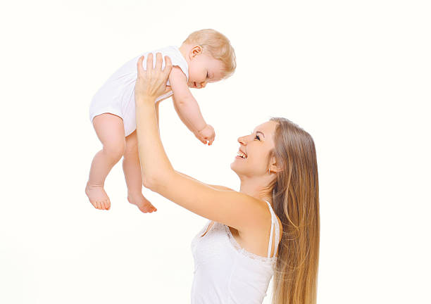 istock Happy smiling mother playing with baby on a white background 508588720