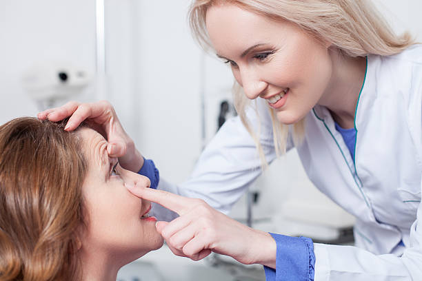 istock Cheerful oculist is checking eyesight of patient 508588802