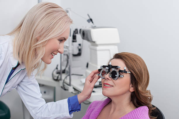 istock Professional eye doctor is examining human vision 508588840