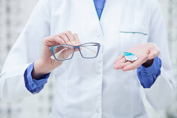 istock Skillful female optician is showing new glasses 508589360