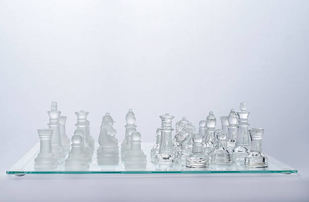 istock glass chess on the transparent chessboard 508593466