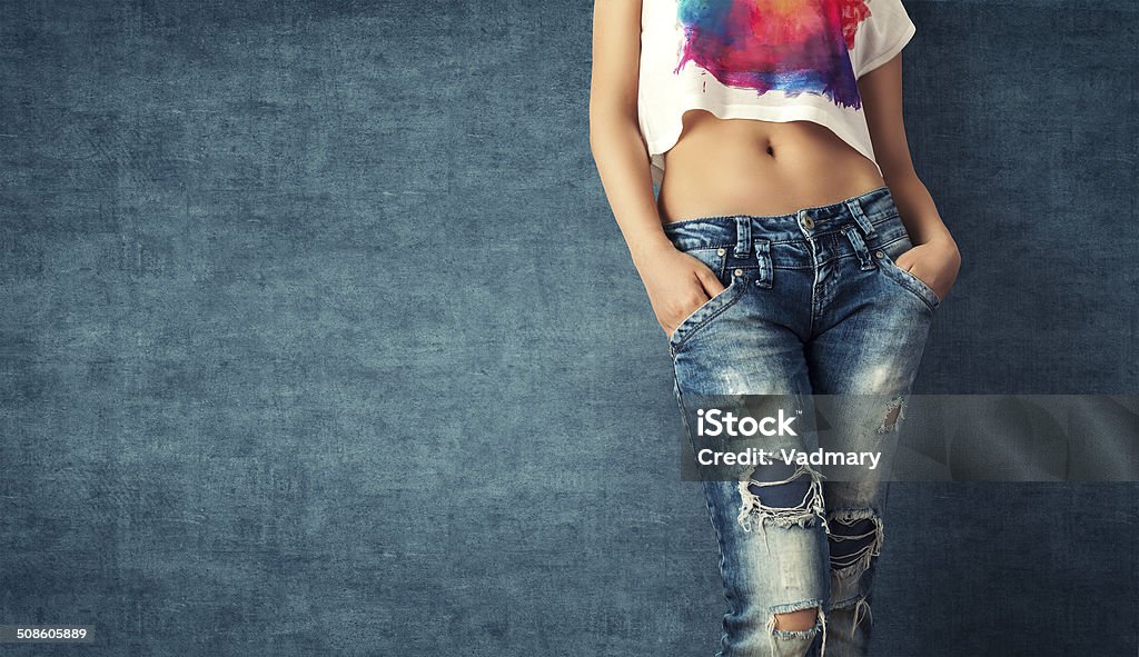 Sexy young woman Sexy young woman in a trendy clothes on a grunge background Adult Stock Photo