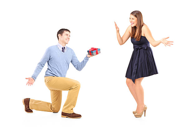 istock Man giving a gift and an excited female 508607085