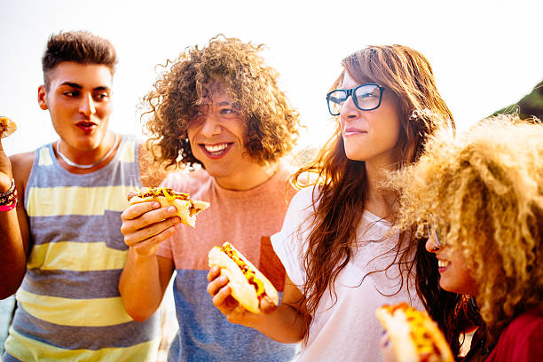istock Friends Eating Hotdogs 508610589