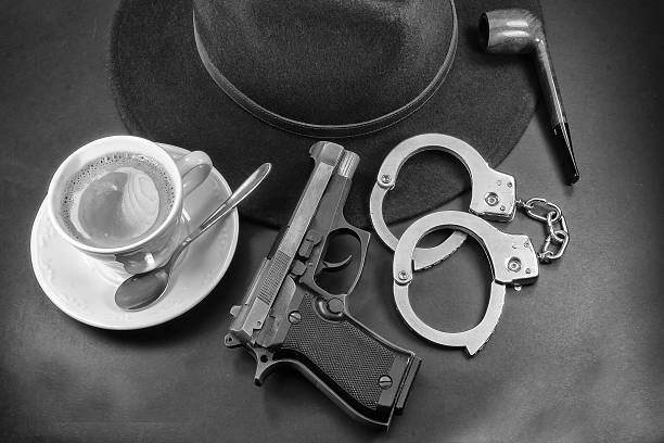 istock coffee detective, hat pipe gun and handcuffs 508610721