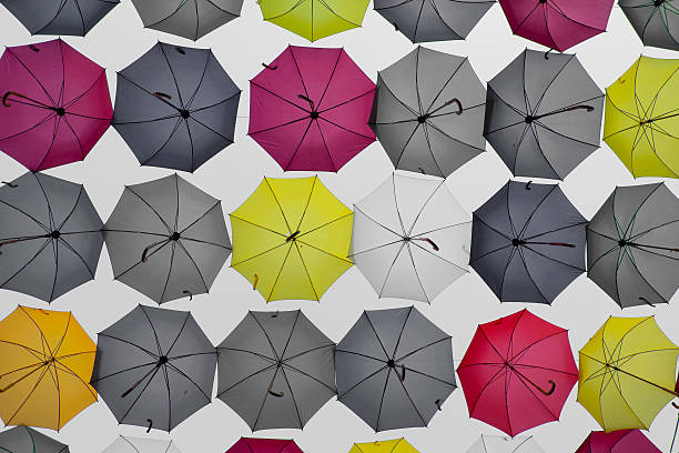 istock umbrella sky yellow, red, and grey 508611227