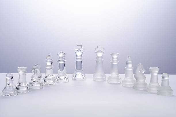 istock glass chess on the transparent chessboard 508618086
