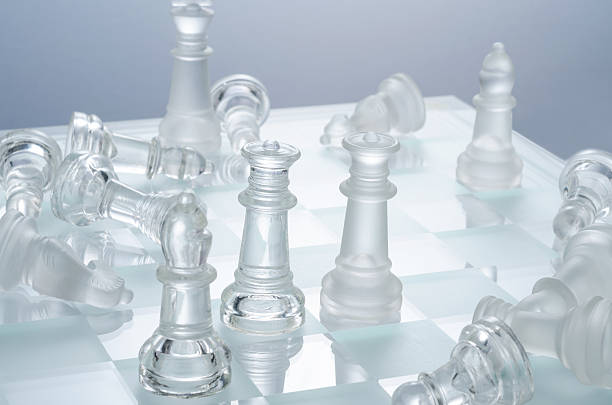 istock glass chess on the transparent chessboard 508618160