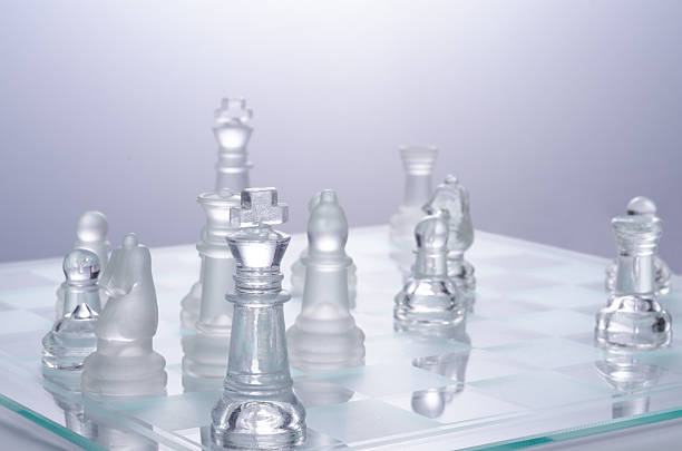 istock glass chess on the transparent chessboard 508618212