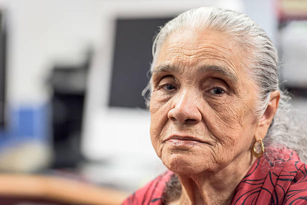 Serious old hispanic senior woman
