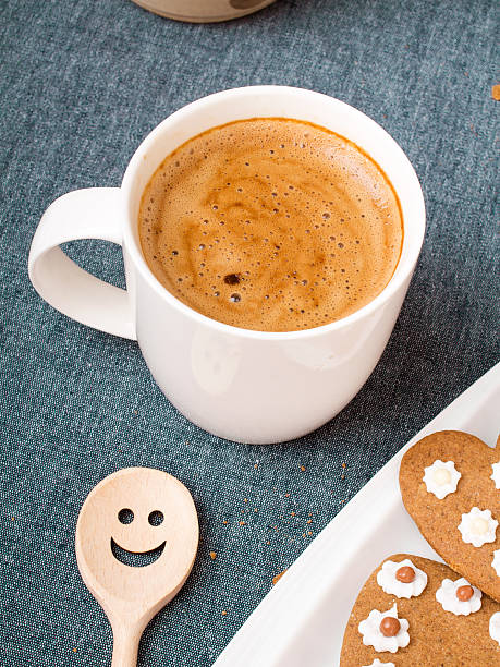 istock Cup of coffee and heart shaped cookies 508620234