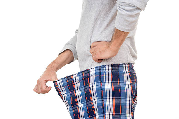 istock Curious Old Man Looking in His Boxer Short 508620428