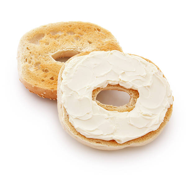 Bagel and Cream Cheese Bagel and Cream Cheese isolated on white (excluding the shadow) sesame bagel stock pictures, royalty-free photos & images